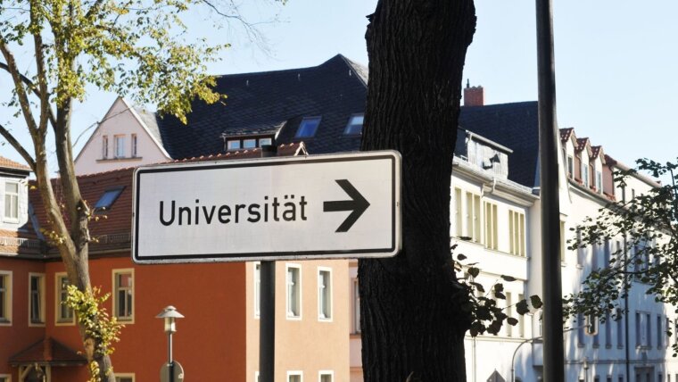 Direction sign to university