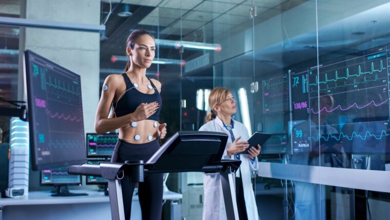 Woman on a treadmill whose data is being measured