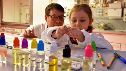 A child makes perfume during the Long Night of Science