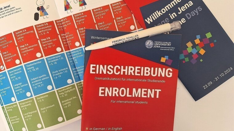 Enrolment Guide with checklist and pen