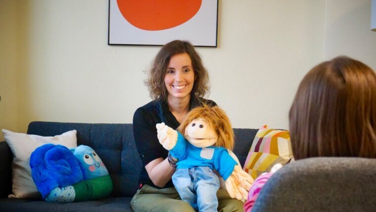 Prof. Dr Julia Asbrand uses a doll during therapy for young people with psychological problems.