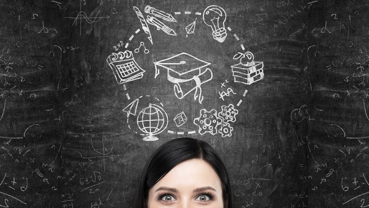 Head in front of a blackboard with symbols that are connected with doing a doctorate